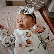 Gracelynn is registered to the contest to win money with this photo: newborn, baby, sleeping, infant, headband, bow, floral_clothing, wooden_buttons, blanket, personalized, name, portrait, closeup, peaceful, indoors, baby_girl, soft_light, cute, resting, birth_details