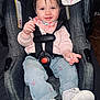 Gracelynn is registered to the contest to win money with this photo: baby, infant, car_seat, harness, buckle, smile, bib, denim_pants, sneakers, blanket, hair, face, eyes, rosy_cheeks, sitting, indoor, safety_label, cute, clothing, hands