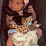 baby, baby_accessory, bear_print, blanket, car_seat, child, clothing, cute, fabric, foot, giraffe_toy, hand, headband, indoors, infant, newborn, pink_bow, portrait, safety_harness, soft_toy