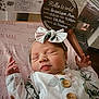 Gracelynn joined the competition — help win amazing prizes! newborn, baby, sleeping, girl, headband, bow, floral, onesie, hospital_bassinet, blanket, name, birth_details, infant, peaceful, cute, portrait, indoor, person, child, soft