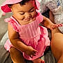 Patience is registered to the contest to win money with this photo: baby, baby_skin, bed, child, clothing, cozy, cute, feet, hand, indoor, infant, legs, person, pink_dress, pink_hat, portrait, sitting, smiling, soft_lighting, toddler