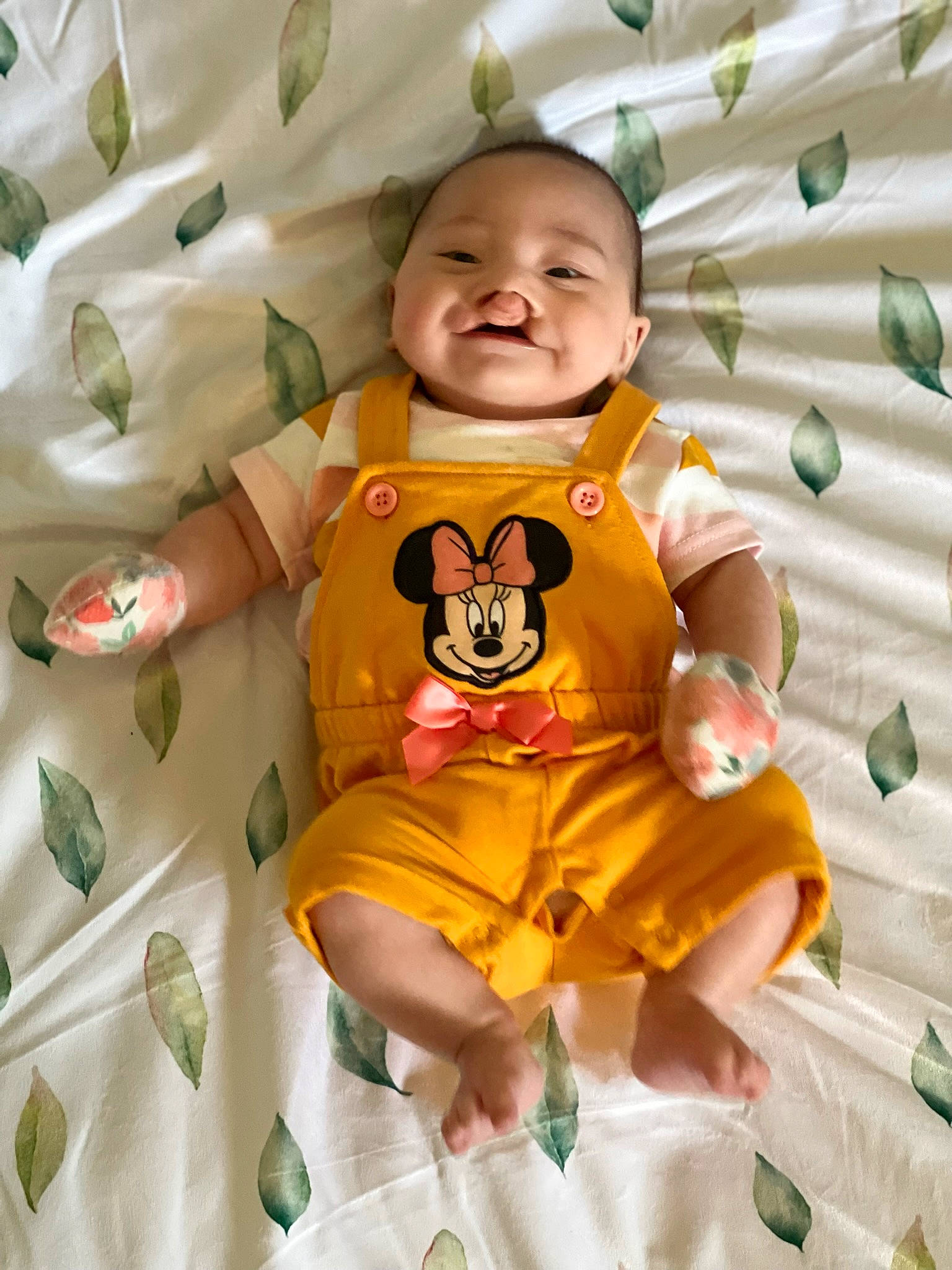 Harmony is registered to the contest to win money with this photo: baby, baby_products, baby_toddler_clothing, child, comfort, fun, happy, linens, pattern, person, pink, product, room, shorts, skin, sleeve, smile, t_shirt, textile, toddler