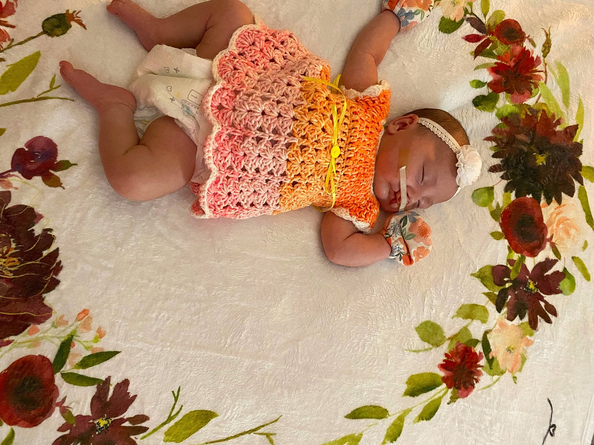 Harmony joined the competition — help win amazing prizes! baby, baby_toddler_clothing, child, comfort, creative_arts, embellishment, event, floral_design, flower, flower_arranging, leaf, linens, pattern, person, petal, plant, red, room, tablecloth, textile