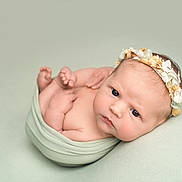 Bonnie joined the competition — help win amazing prizes! newborn, baby, infant, portrait, wrapped, blanket, flower_crown, headband, skin, face, eyes, hands, feet, soft_lighting, studio, cute, peaceful, lying_down, pastel_colors, closeup