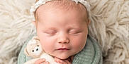 Bonnie joined the competition — help win amazing prizes! newborn, baby, sleeping, teddy_bear, soft_blanket, knit, headband, cute, infant, portrait, cozy, fluffy_rug, peaceful, wrapped, child, tiny_hands, face, closed_eyes, soft_lighting, indoors