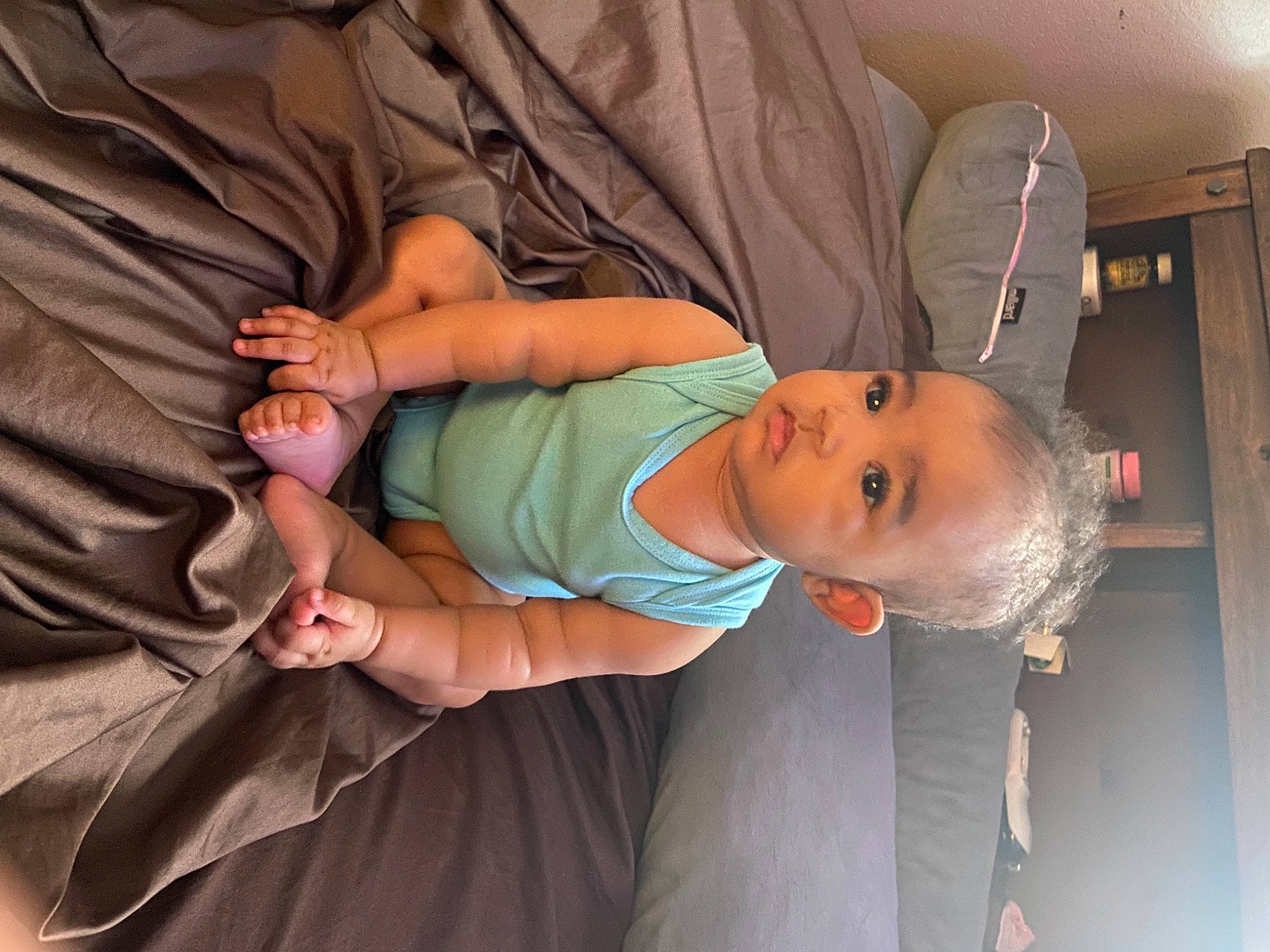 Anaya Lamai is registered to the contest to win money with this photo: abdomen, baby, baby_carriage, baby_products, baby_toddler_clothing, cheek, child, comfort, elbow, finger, glasses, hand, hat, leg, mammal, person, room, sitting, skin, toddler