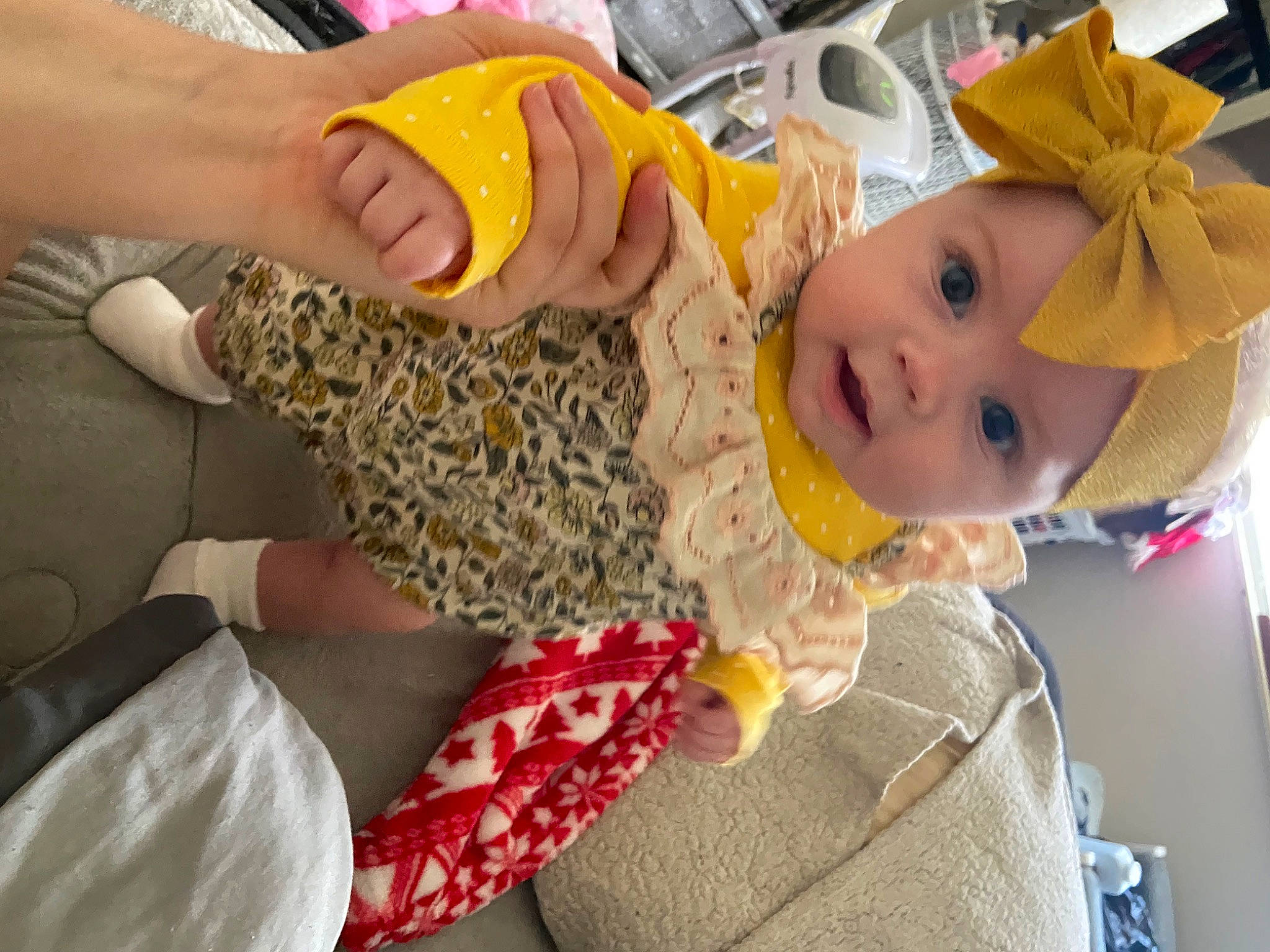 Adelynn is registered to the contest to win money with this photo: baby, baby_products, baby_toddler_clothing, child, flooring, foot, fun, happy, hat, headwear, human_leg, leisure, nail, pattern, person, play, room, sitting, stuffed_toy, thumb