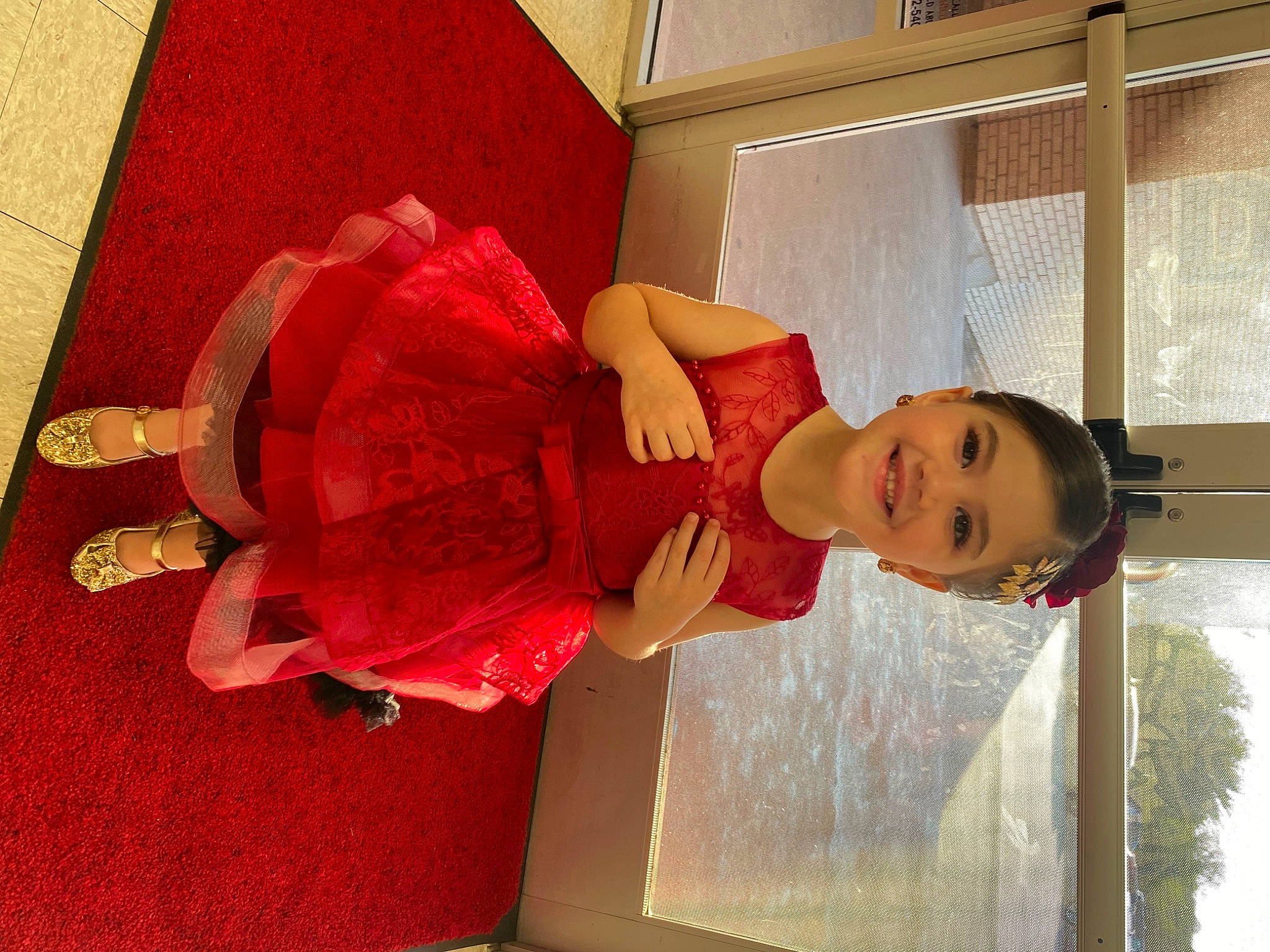 Tesla is registered to the contest to win money with this photo: baby, baby_toddler_clothing, carmine, child, costume, embellishment, flooring, fun, happy, joy, magenta, pattern, peach, person, room, smile, textile, toddler, window