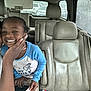 child, adult, car_interior, smile, happy, portrait, seat, seatbelt, window, rain, clothing, hand, face, headrest, family, casual, skin, fingernails, person, toddler
