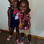 Kahmani is registered to the contest to win money with this photo: child, children, smiling, indoor, carpet, sneakers, peace_sign, girl, boy, red_bow, braids, plaid_shirt, shorts, navy_dress, red_shoes, happy, posing, standing, friends, cute