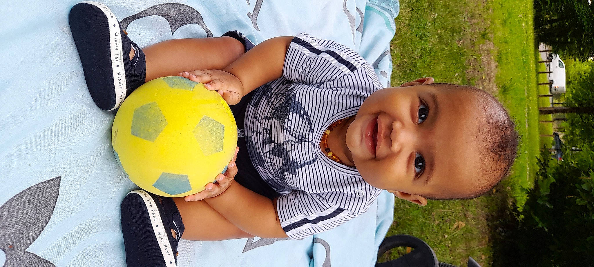 Rhaylonn participe au concours pour gagner de l'argent avec cette photo : baby, baby_toddler_clothing, ball, clothing, facial_expression, football, fun, happy, human, human_body, joy, leisure, people_in_nature, person, plant, shirt, smile, sports_equipment, t_shirt, toddler