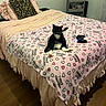Harley is registered to the contest to win money with this photo: cat, tuxedo_cat, animal, pet, sitting, bed, bedroom, blanket, bedspread, hearts, pink, black_and_white, whiskers, ears, tail, game_controller, pillow, furniture, indoor, home