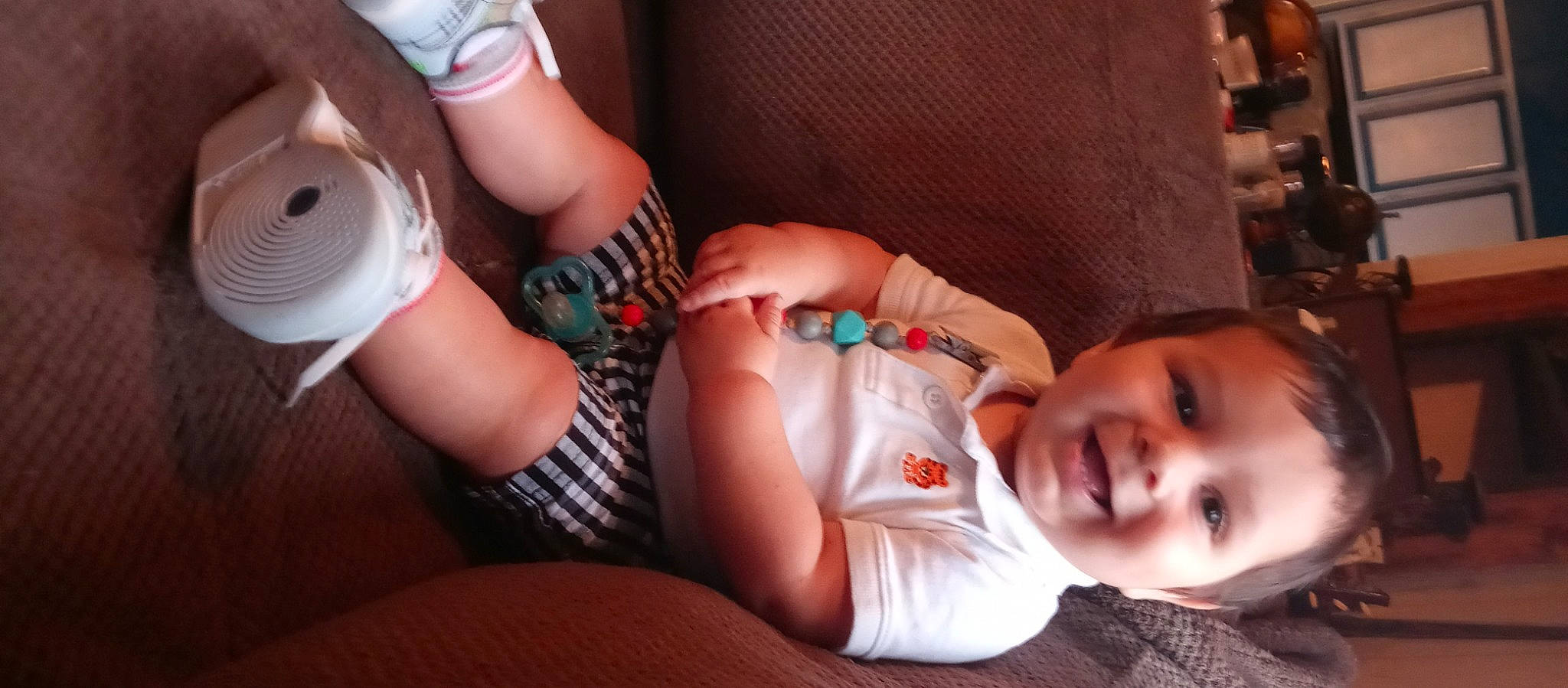 Fletcher is registered to the contest to win money with this photo: baby, baby_toddler_clothing, comfort, elbow, finger, hand, human_body, human_leg, joy, knee, lap, mammal, mouth, muscle, nail, person, skin, sock, thigh, thumb