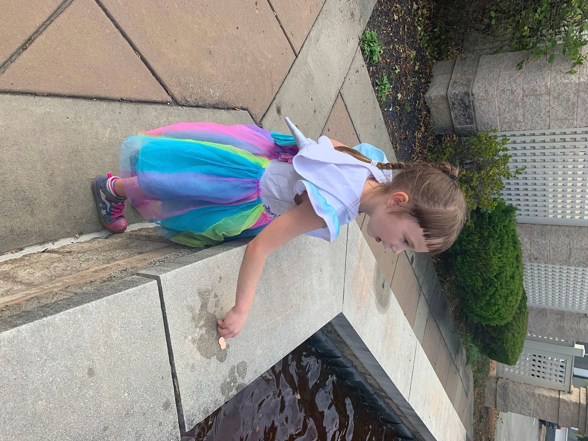 Mackenzie joined the competition — help win amazing prizes! asphalt, child, electric_blue, fun, grass, human_leg, leisure, magenta, person, plant, play, road_surface, sidewalk, sitting, street_fashion, thigh, toddler, vacation, water