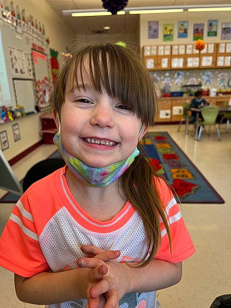 Mackenzie joined the competition — help win amazing prizes! bangs, chair, child, event, flooring, fun, gesture, happy, human, joy, leisure, person, picture_frame, play, recreation, room, skin, smile, t_shirt, thumb