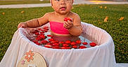 Adalyn joined the competition — help win amazing prizes! 7_months, baby, celebration, child, cute, flowers, garden, grass, infant, milestone, outdoor, pink_headband, pink_top, portrait, sign, strawberries, summer, sunset, tub, water