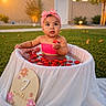 Adalyn joined the competition — help win amazing prizes! baby, infant, tub, strawberries, pink_headband, pink_top, water, outdoor, grass, sunset, milestone, sign, flowers, cute, portrait, child, 7_months, celebration, summer, garden