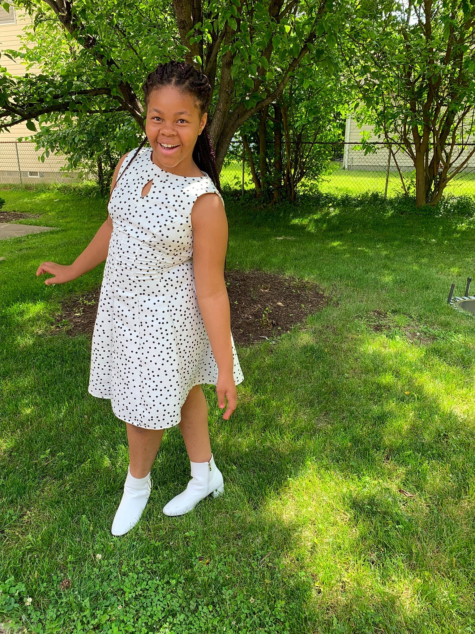 Favour is registered to the contest to win money with this photo: child, clothing, dress, footwear, grass, grass_family, green, joy, lawn, pattern, person, plant, shoe, spring, summer, toddler, tree