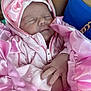 baby, newborn, sleeping, pink, blanket, bow, hood, clothing, hand, person, infant, soft, cute, portrait, closeup, warm, cozy, resting, fabric, cuddle