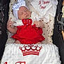 Emilie participe au concours pour gagner de l'argent avec cette photo : baby, sleeping, stroller, blanket, headband, bow, clothing, red, white, heart_pattern, plush, infant, cute, peaceful, textile, fabric, portrait, closeup, child, cozy