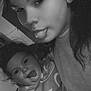 child, toddler, woman, face, tongue_out, black_and_white, portrait, curly_hair, emojis, broken_heart, sweater, indoor, playful, selfie, person, expression, cute, fun, closeup, happy