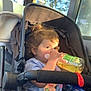 Mackenzie-Lee is registered to the contest to win money with this photo: toddler, child, stroller, bus, window, bottle, pacifier, sunlight, curly_hair, clothing, seat, hand, plastic_bottle, reflection, interior, daylight, portrait, young_child, sitting, transportation