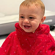 Hunter joined the competition — help win amazing prizes! baby, child, smiling, red_towel, hooded_towel, happy, face, portrait, infant, cute, indoor, closeup, skin, head, young, expression, warm, toddler, person, cheerful