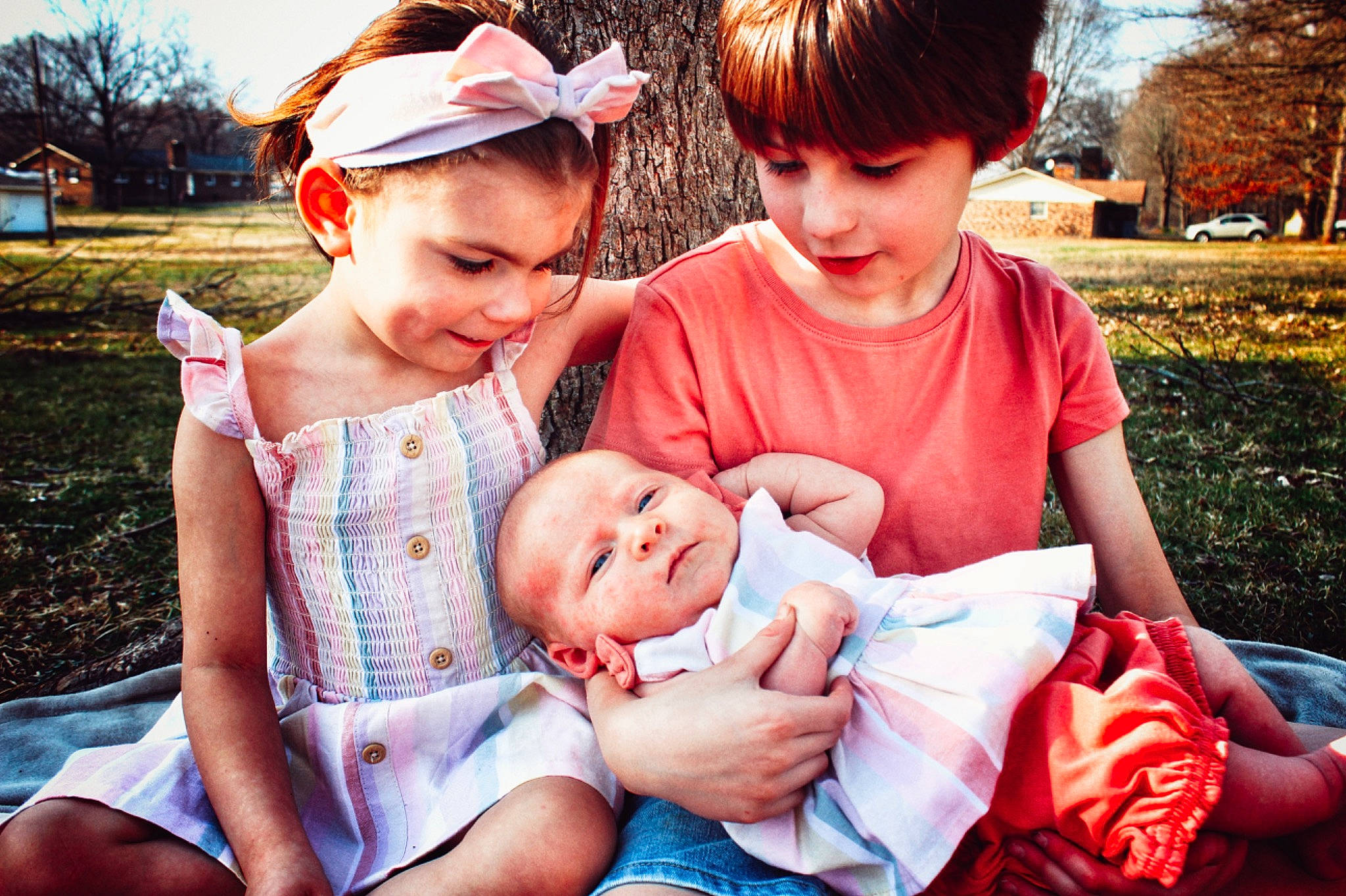 Lakota joined the competition — help win amazing prizes! baby_toddler_clothing, face, fun, grass, hairstyle, happy, head, interaction, leaf, organ, people_in_nature, person, photograph, pink, plant, red, shorts, skin, smile, toddler