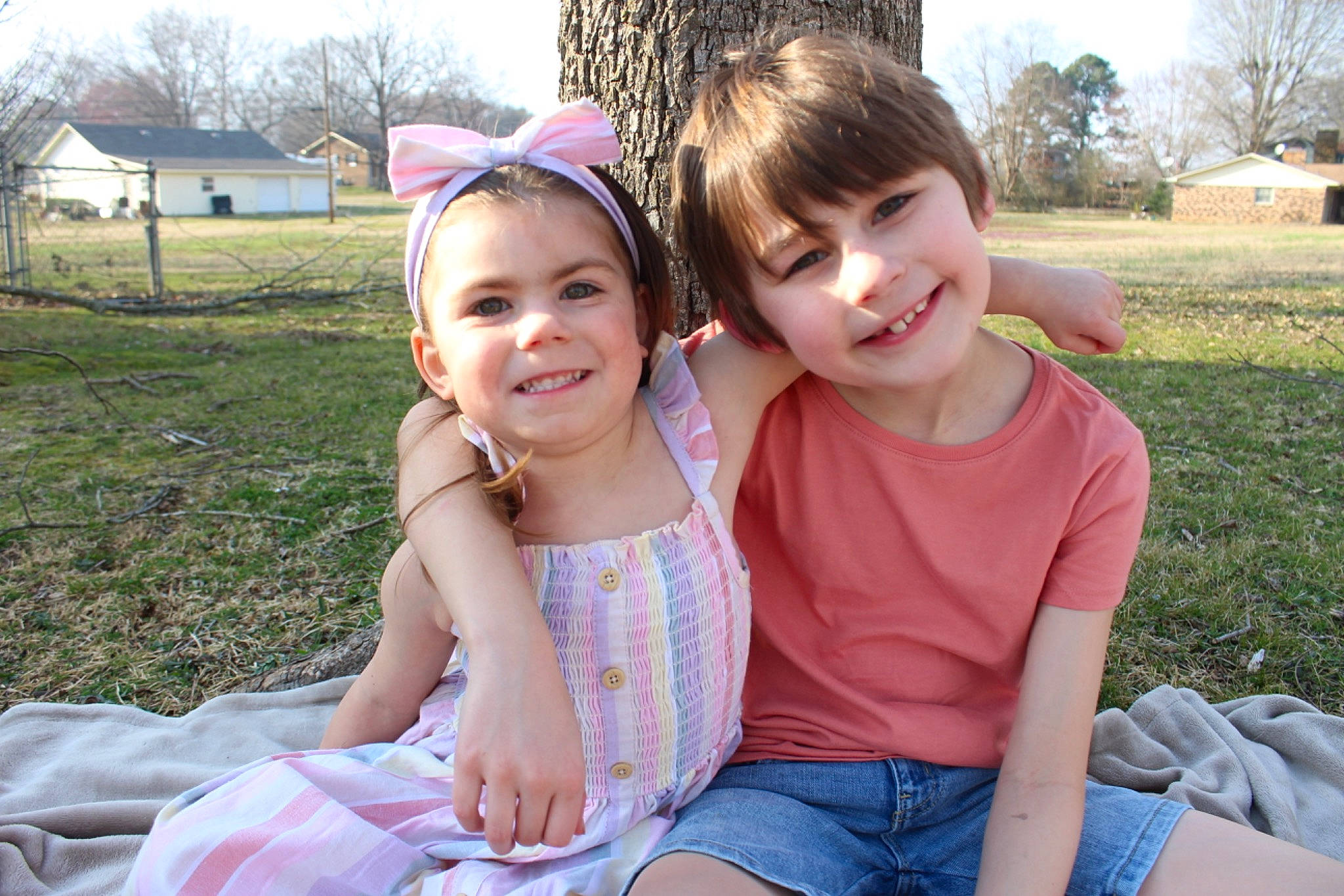 Amara is registered to the contest to win money with this photo: event, face, facial_expression, friendship, fun, grass, happy, head, headwear, joy, lap, leisure, people_in_nature, person, plant, recreation, shorts, skin, smile, summer