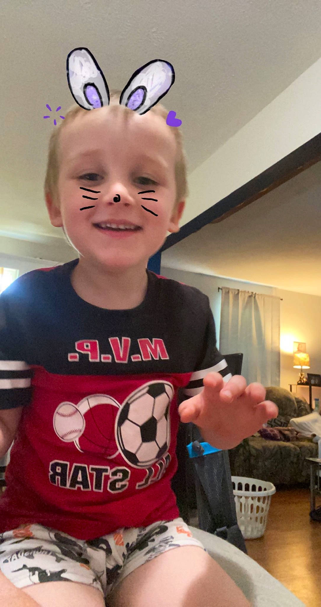 Rhydian is registered to the contest to win money with this photo: carmine, child, cool, eye, eyewear, finger, fun, hairstyle, happy, human, joy, mouth, pattern, people, person, personal_protective_equipment, product, sleeve, smile, t_shirt