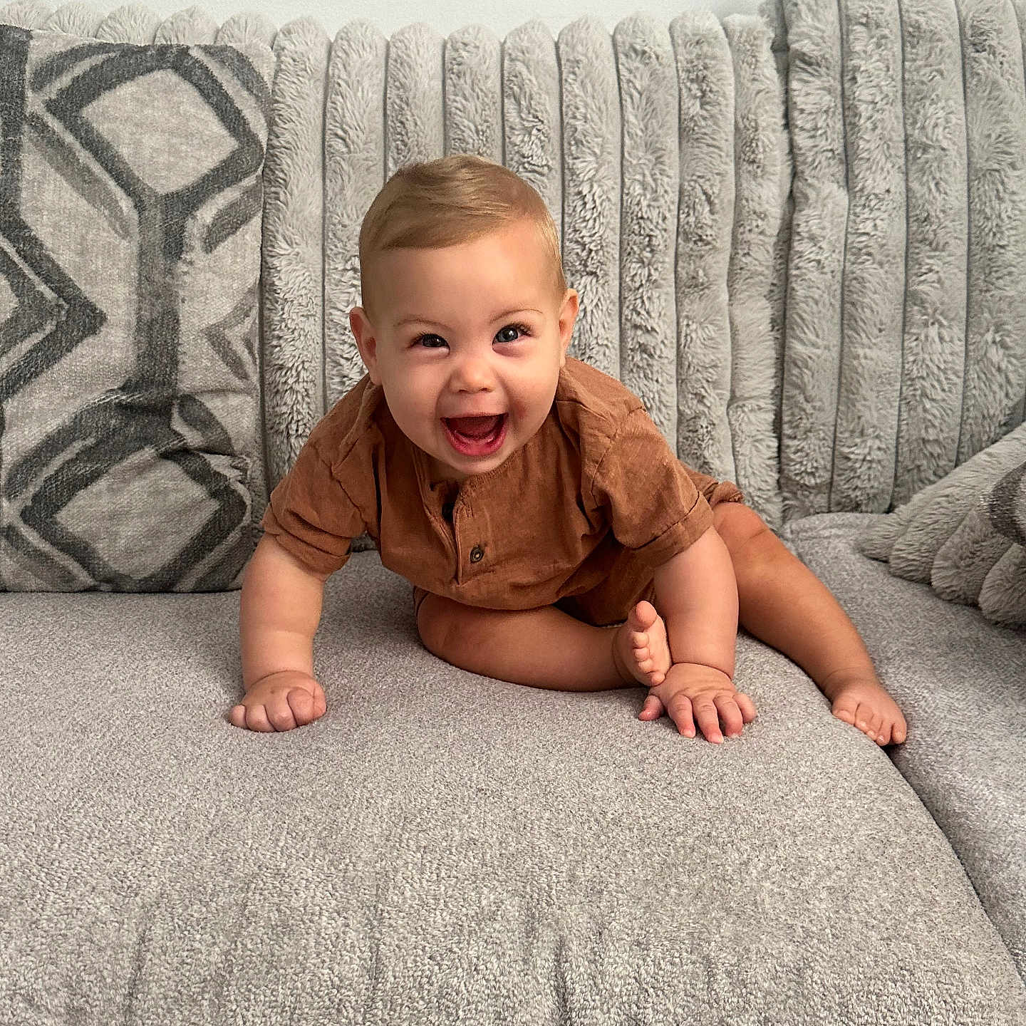 Noah joined the competition — help win amazing prizes! baby, child, couch, cushion, fabric, furniture, happiness, indoor, infant, joyful, kid, living_room, person, plush, portrait, sitting, smiling, soft, toddler, wearing_clothes