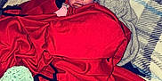 Skylynn is registered to the contest to win money with this photo: baby, blanket, bed, pillow, hat, red_blanket, knitted_throw, face, infant, indoors, person, cozy, cute, lying_down, patterned_pillow, expression, pacifier, headwear, soft_fabric, resting
