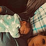 Skylynn is registered to the contest to win money with this photo: baby, blanket, sleeping, person, face, pillow, plaid, indoor, resting, cozy, child, blanket_pattern, ear, head, skin, adult, lying_down, closeup, soft_texture, home