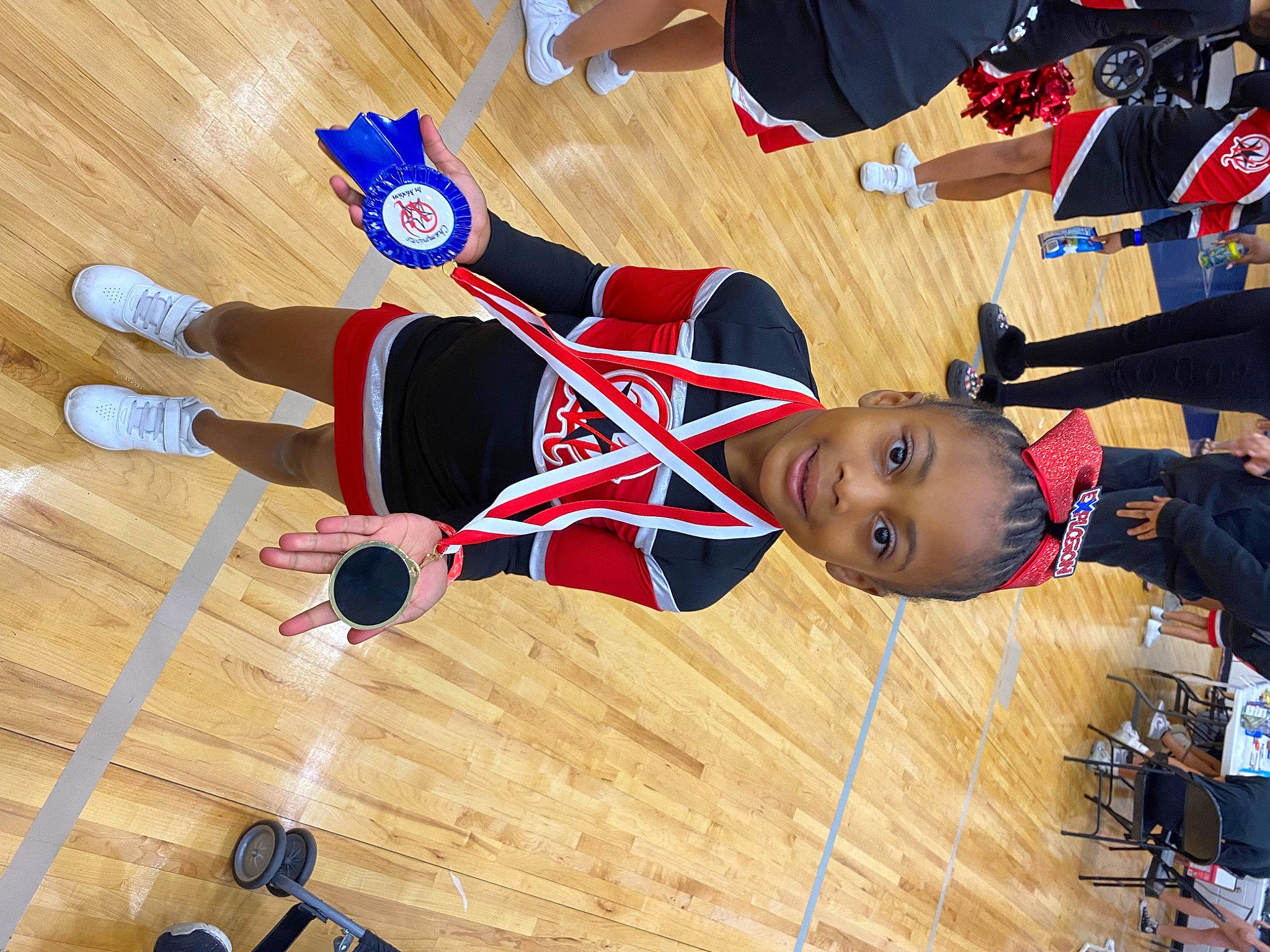 Calanie is registered to the contest to win money with this photo: ball_game, carmine, competition, competition_event, flooring, fun, hardwood, joy, knee, person, player, sports, sports_jersey, sports_uniform, sportswear, team_sport, thigh, tournament, uniform, varnish