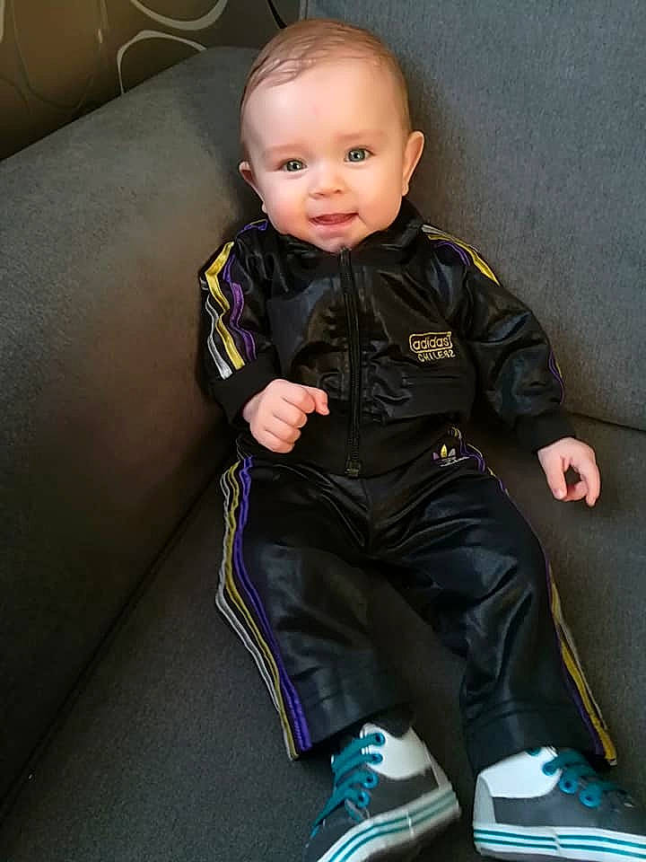 Kenzo participe au concours pour gagner de l'argent avec cette photo : baby, cheek, child, child_model, jacket, leather, leather_jacket, outerwear, person, product, sitting, sleeve, textile, toddler