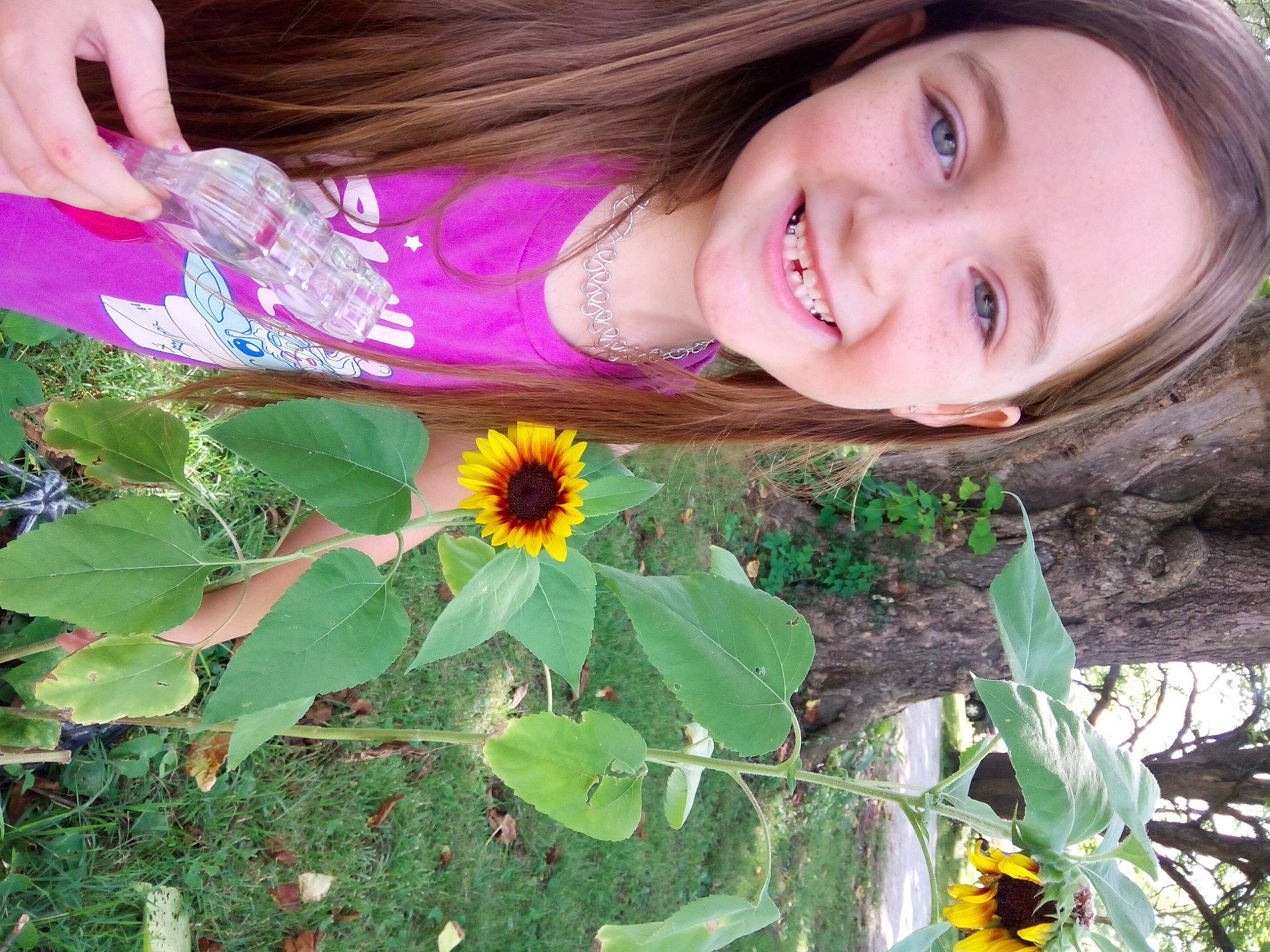 Paizleigh joined the competition — help win amazing prizes! annual_plant, beauty, botany, eye, flower, flowering_plant, grass, green, groundcover, happy, joy, leaf, nature, people_in_nature, person, petal, plant, smile, sunflower, terrestrial_plant