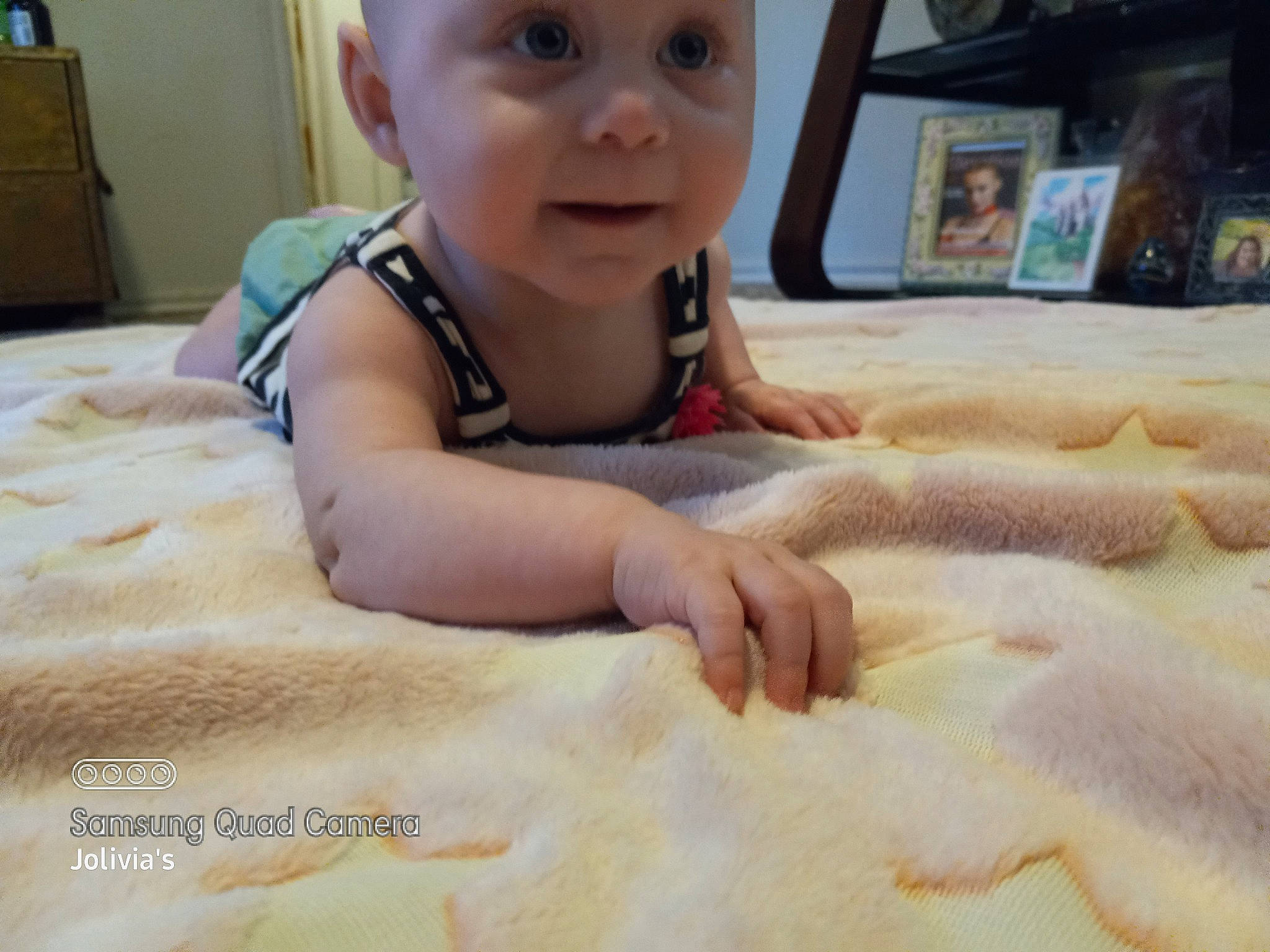 Ana joined the competition — help win amazing prizes! baby, baby_toddler_clothing, blurred, cabinetry, chest_of_drawers, child, comfort, crawling, eye, floor, flooring, fun, hardwood, headwear, linens, person, room, skin, smile, thumb