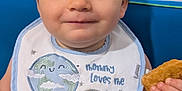 Wyatt is registered to the contest to win money with this photo: baby, background, bib, child, clothing, cute, diaper, expression, face, food, hand, happy, indoor, infant, person, short_hair, sitting, skin, smile, snack