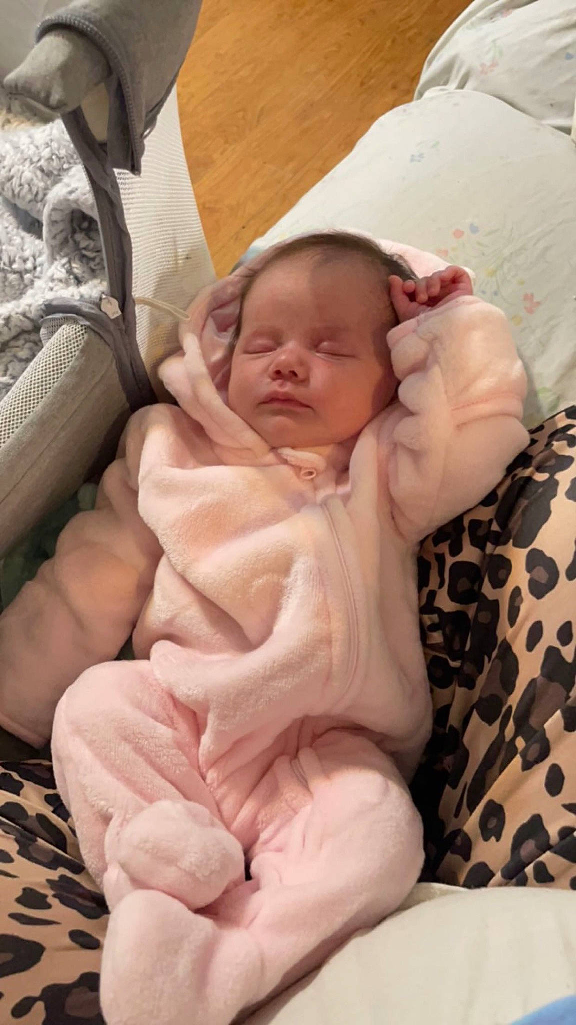 Riley is registered to the contest to win money with this photo: abdomen, baby, baby_products, baby_safety, baby_sleeping, baby_toddler_clothing, cheek, chest, child, comfort, finger, foot, hand, linens, person, pink, sitting, skin, stomach, thumb