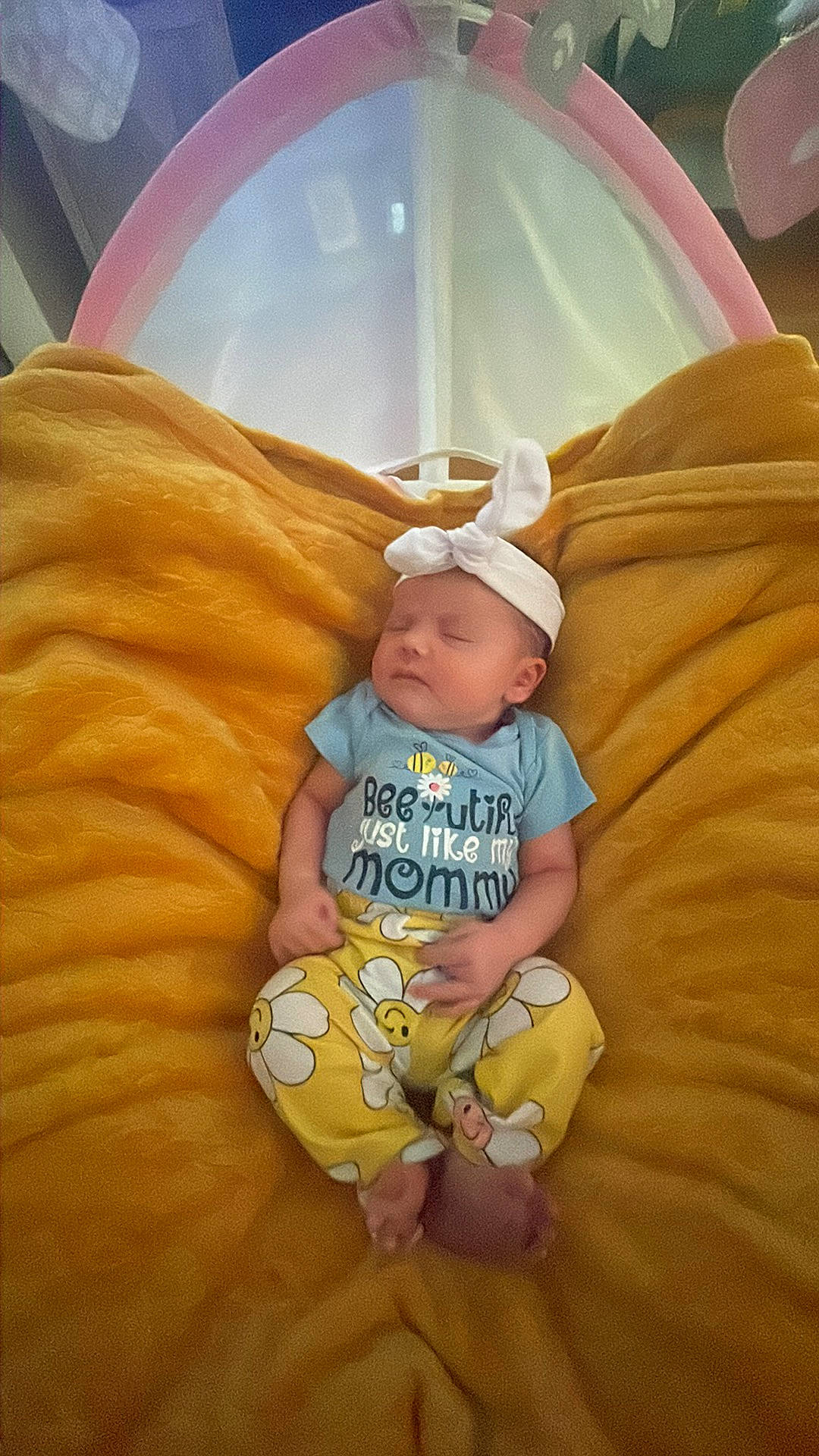 Riley is registered to the contest to win money with this photo: baby, baby_toddler_clothing, child, comfort, flooring, fun, grass, happy, hat, human_leg, linens, person, room, sitting, sock, t_shirt, thigh, thumb, toddler, vacation