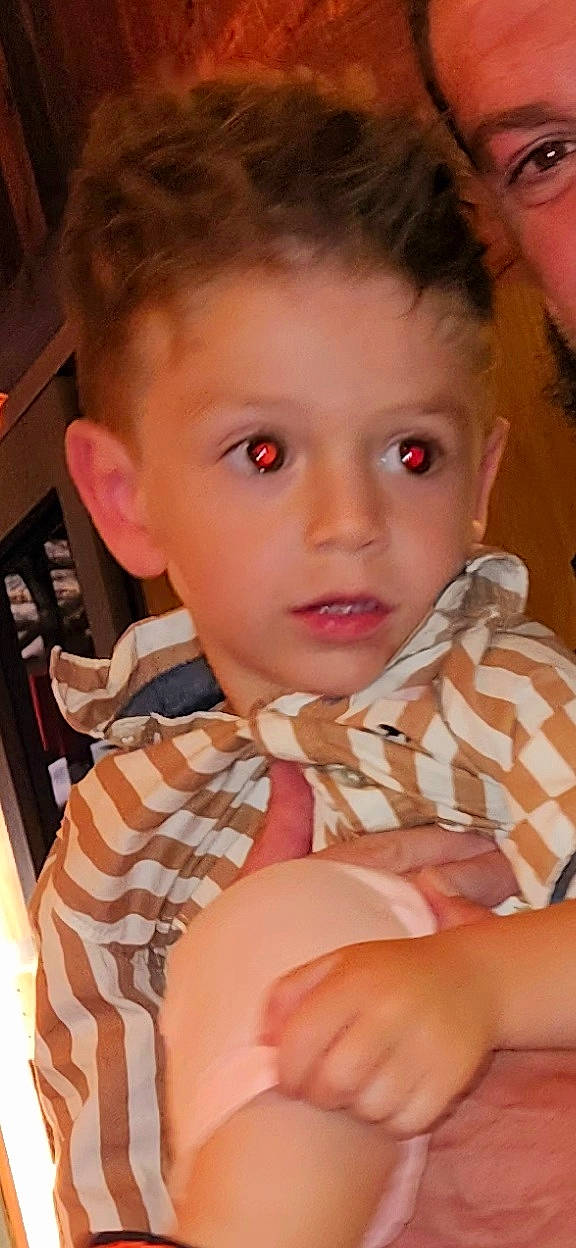 Roman is registered to the contest to win money with this photo: cheek, chin, dress, ear, eyebrow, eyelash, forehead, fun, gesture, hand, happy, human_body, iris, lip, mouth, neck, nose, person, skin, thumb