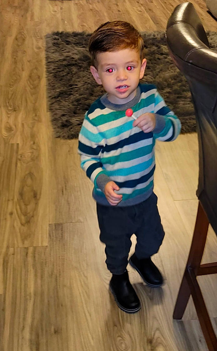 Roman joined the competition — help win amazing prizes! baby_toddler_clothing, chair, child, electric_blue, eye, face, floor, flooring, fun, hardwood, head, leg, person, sitting, sleeve, standing, t_shirt, toddler, tree, wood