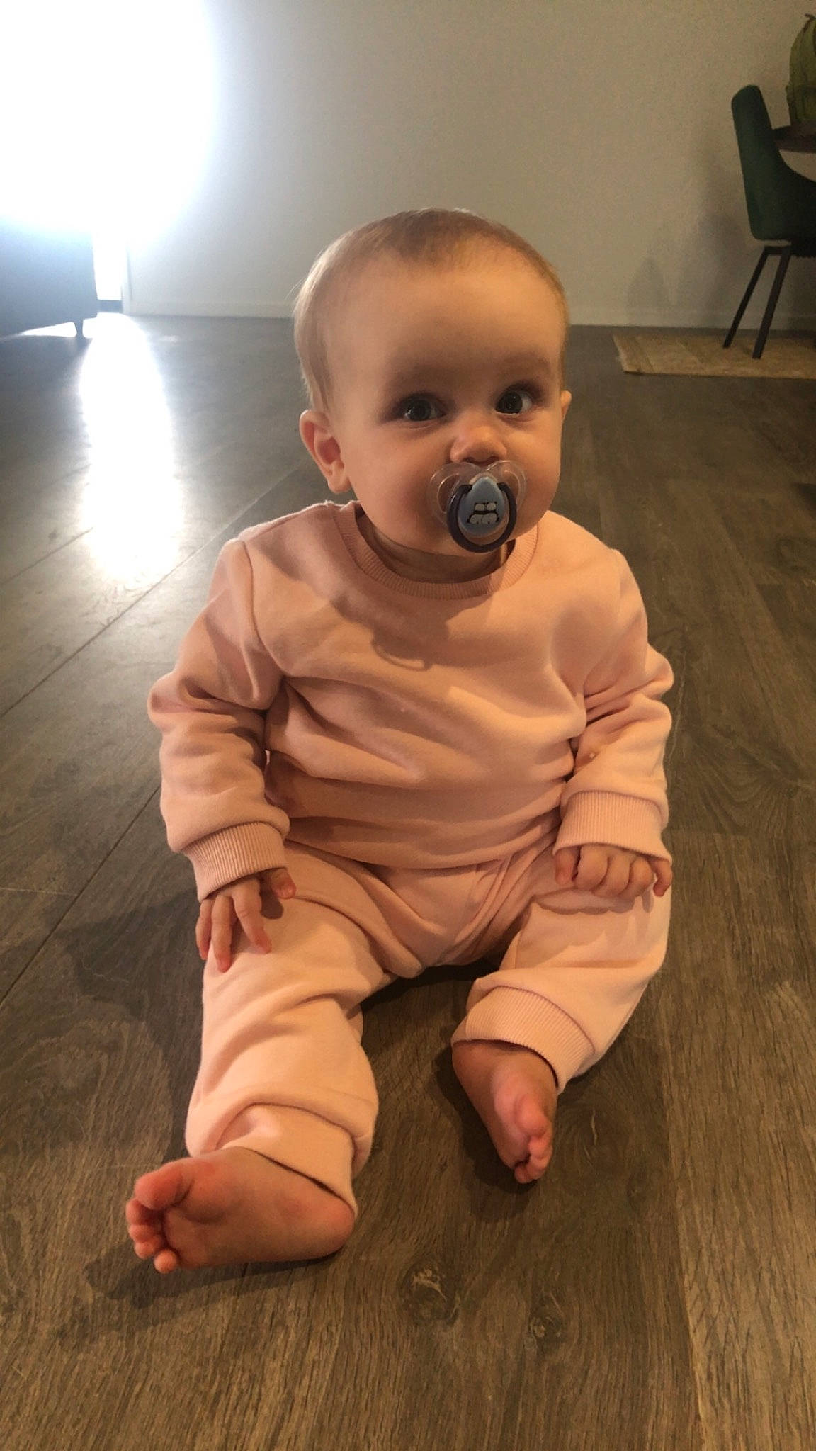 Hailey is registered to the contest to win money with this photo: baby, baby_toddler_clothing, cheek, comfort, crawling, eye, finger, floor, flooring, foot, happy, hardwood, head, laminate_flooring, nose, person, skin, sleeve, toddler, wood