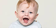 Rex is registered to the contest to win money with this photo: baby, child, smiling, happy, blue_eyes, blond_hair, sweater, cloud_pattern, portrait, close_up, cute, infant, joyful, expression, face, head, skin, young, indoor, studio