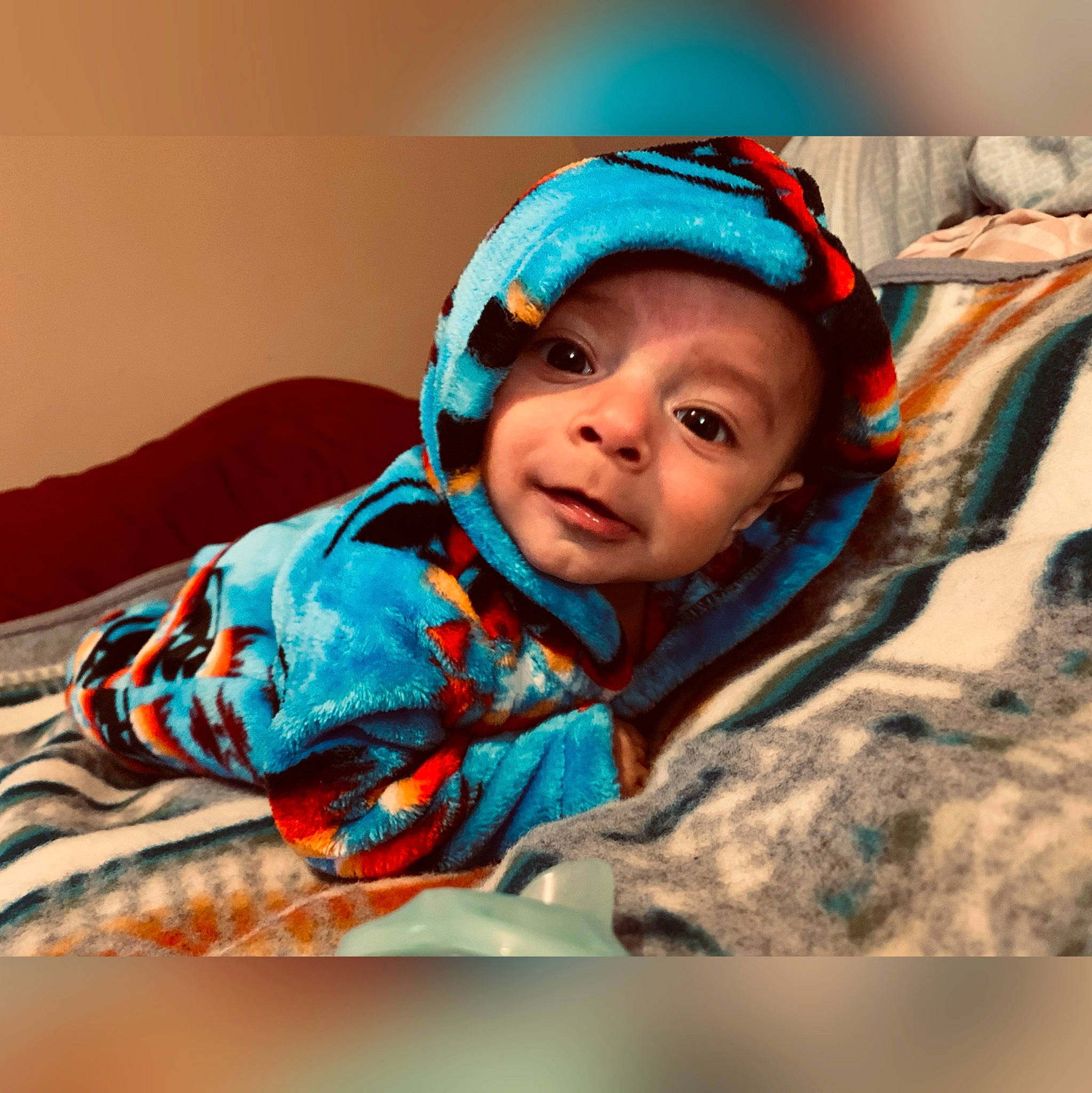 Jerome joined the competition — help win amazing prizes! baby, cap, child, comfort, cool, electric_blue, fun, fur, happy, headgear, headwear, human_body, jacket, knit_cap, linens, outerwear, person, room, sitting, sleeve