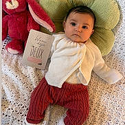 Victoire a rejoint le concours — aidez-le/la à gagner de superbes lots ! baby, infant, plush_bunny, green_pillow, knitted_blanket, milestone_card, deux_mois, cardigan, rust_pants, socks, portrait, lying_down, indoor, cozy, soft_toy, crochet_blanket, milestone, adorable, looking_at_camera, baby_face