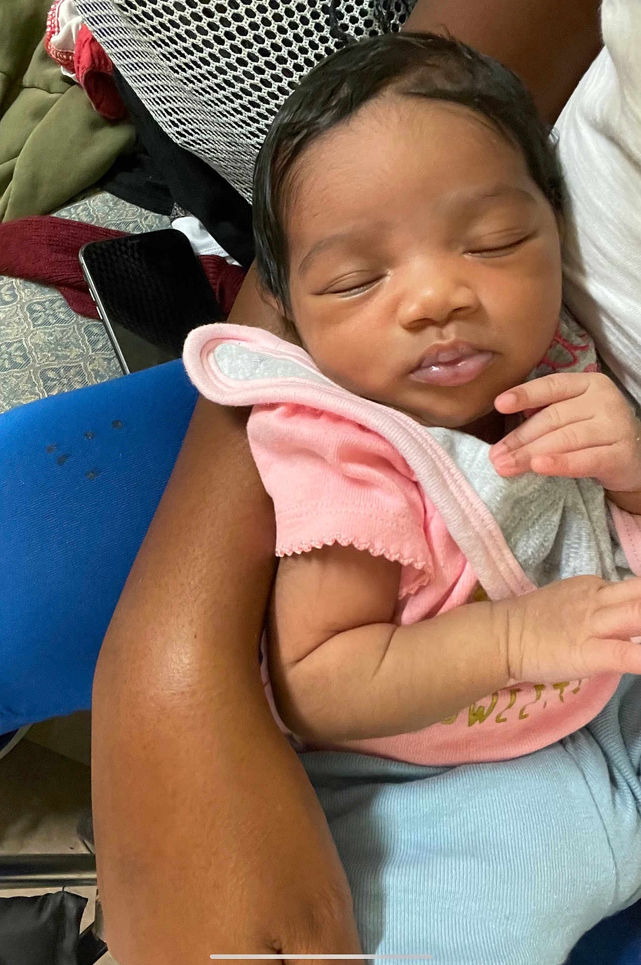 Niylah is registered to the contest to win money with this photo: baby, sleeping, infant, arm, pink_clothing, couch, blanket, person, closeup, indoor, skin, hand, comfort, peaceful, resting, toddler, holding, soft, cute, portrait