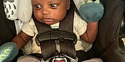 Roman joined the competition — help win amazing prizes! baby, car_seat, infant, mittens, booties, straps, safety, child, clothing, cute, dinosaur, expression, seat, young_child, indoors, person, head_support, black, white, gray