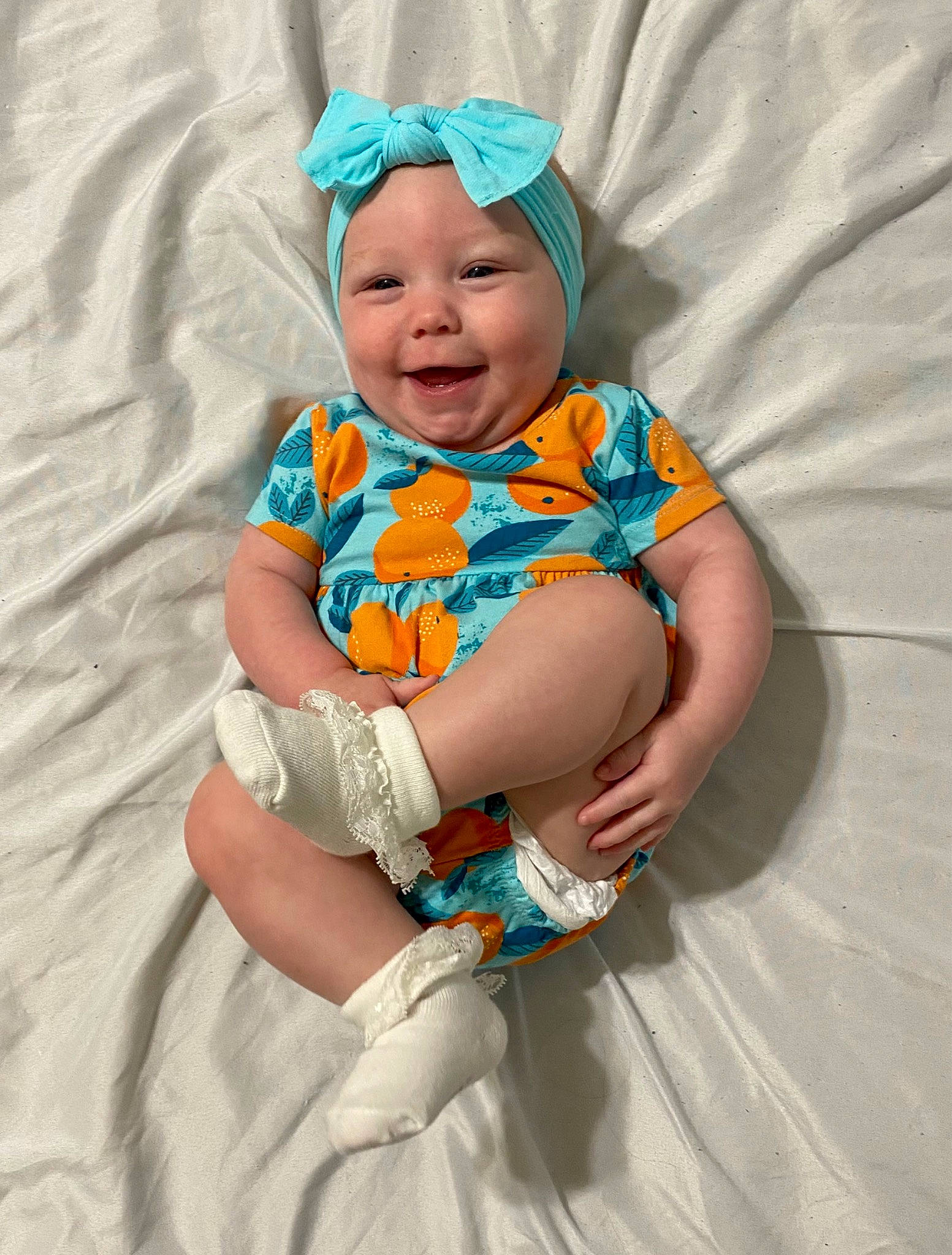 Adaline is registered to the contest to win money with this photo: baby, baby_products, baby_toddler_clothing, blue, cap, child, comfort, face, finger, fun, happy, headgear, headwear, joy, pattern, person, pink, purple, sitting, skin