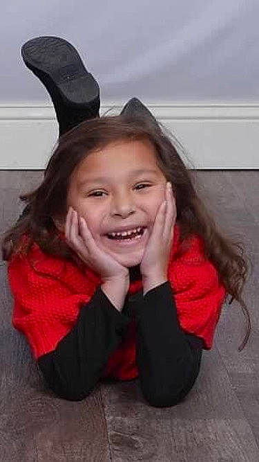 Amiyah Jean Barber is registered to the contest to win money with this photo: black_hair, cheek, clothing, ear, eye, eyebrow, face, flash_photography, gesture, happy, headgear, human_body, jaw, joy, lip, mouth, neck, nose, person, smile